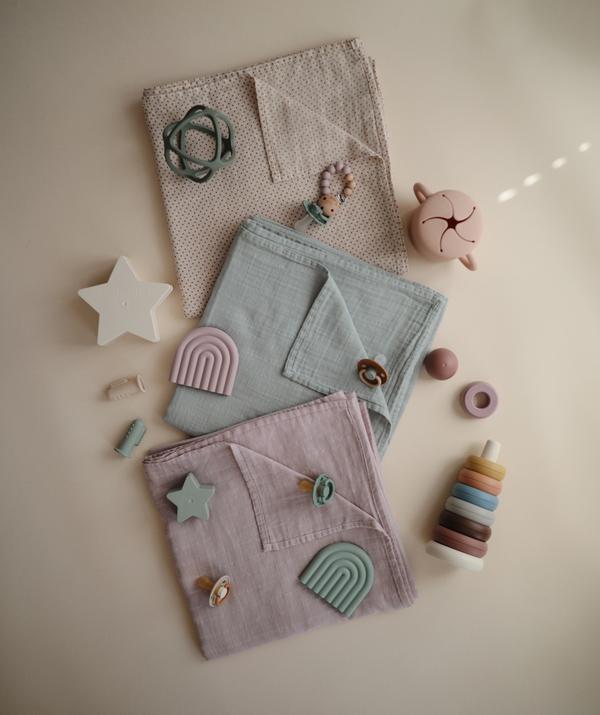 Muslin swaddle soft mauve mushie muslin mushie