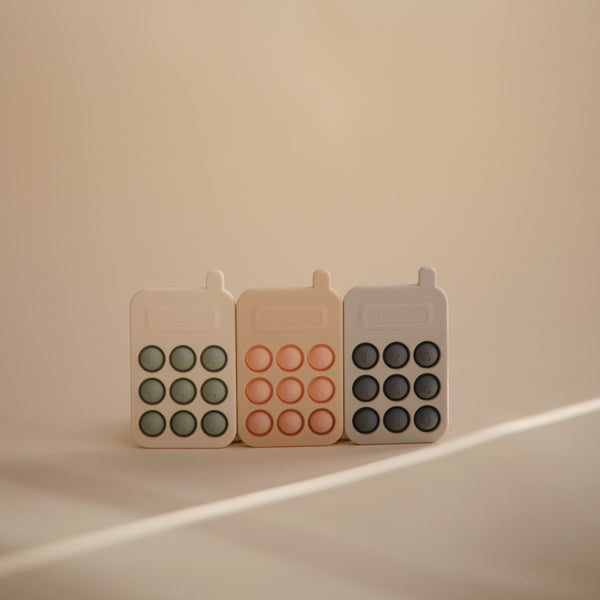 Phone press toy cambridge blue mushie Toys mushie